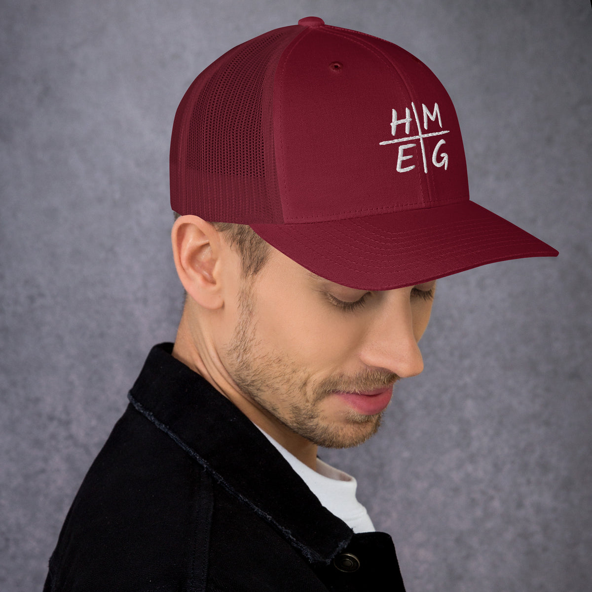 Cranberry HMEG Christian trucker hat with white embroidered lettering