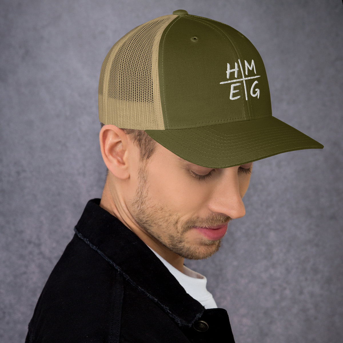Moss green and khaki HMEG Christian trucker hat with embroidered design