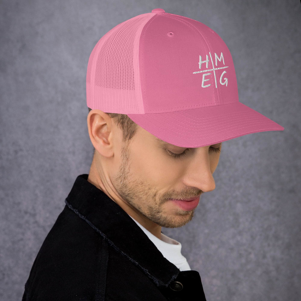 Pink HMEG Christian trucker hat with white embroidered front