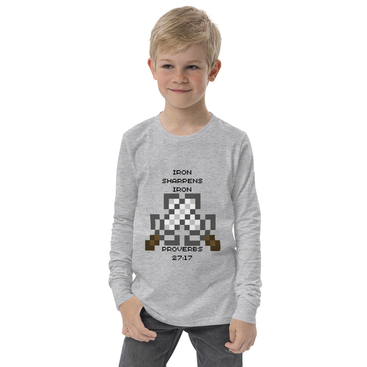 Boy modeling Athletic Heather Iron Sharpens Iron Christian youth long sleeve shirt with retro gaming design