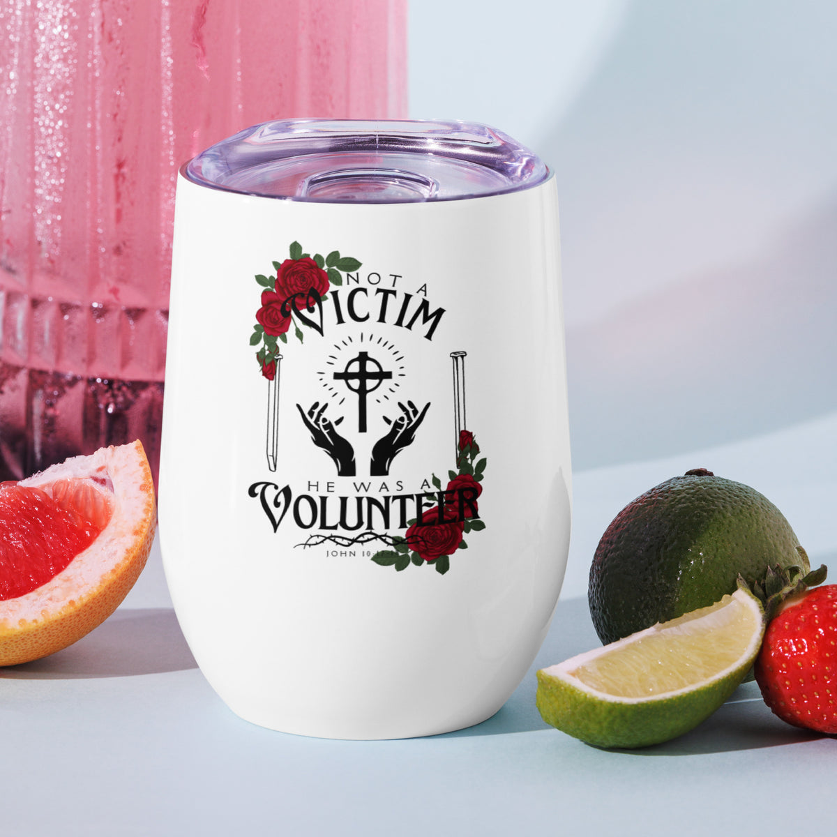 White Not a Victim Christian wine tumbler displayed with fruit in the background