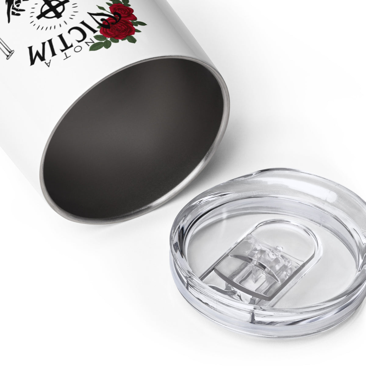 Top of white Not a Victim wine tumbler shown beside its clear sip lid