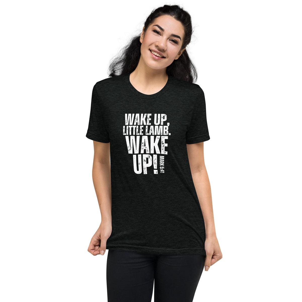 Model wearing a charcoal-black Wake Up Little Lamb Christian T-shirt with white front graphic