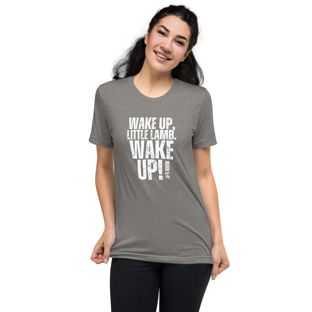 Woman wearing a grey Wake Up Little Lamb Christian T-shirt with white front graphic
