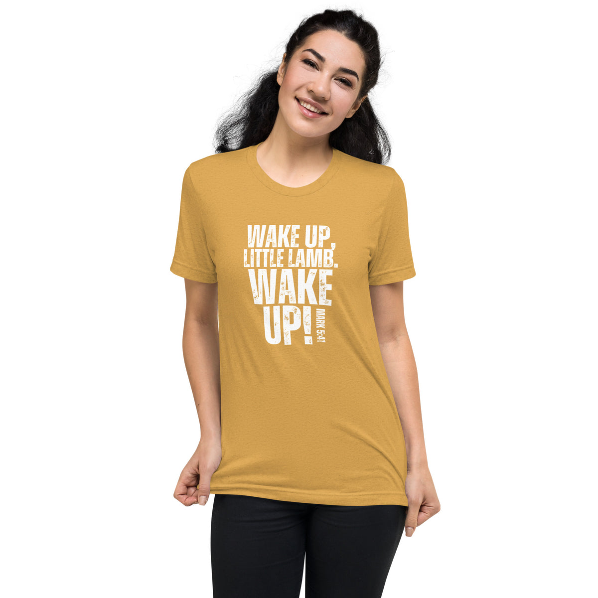 Woman wearing a mustard yellow Wake Up Little Lamb Christian T-shirt with white lettering
