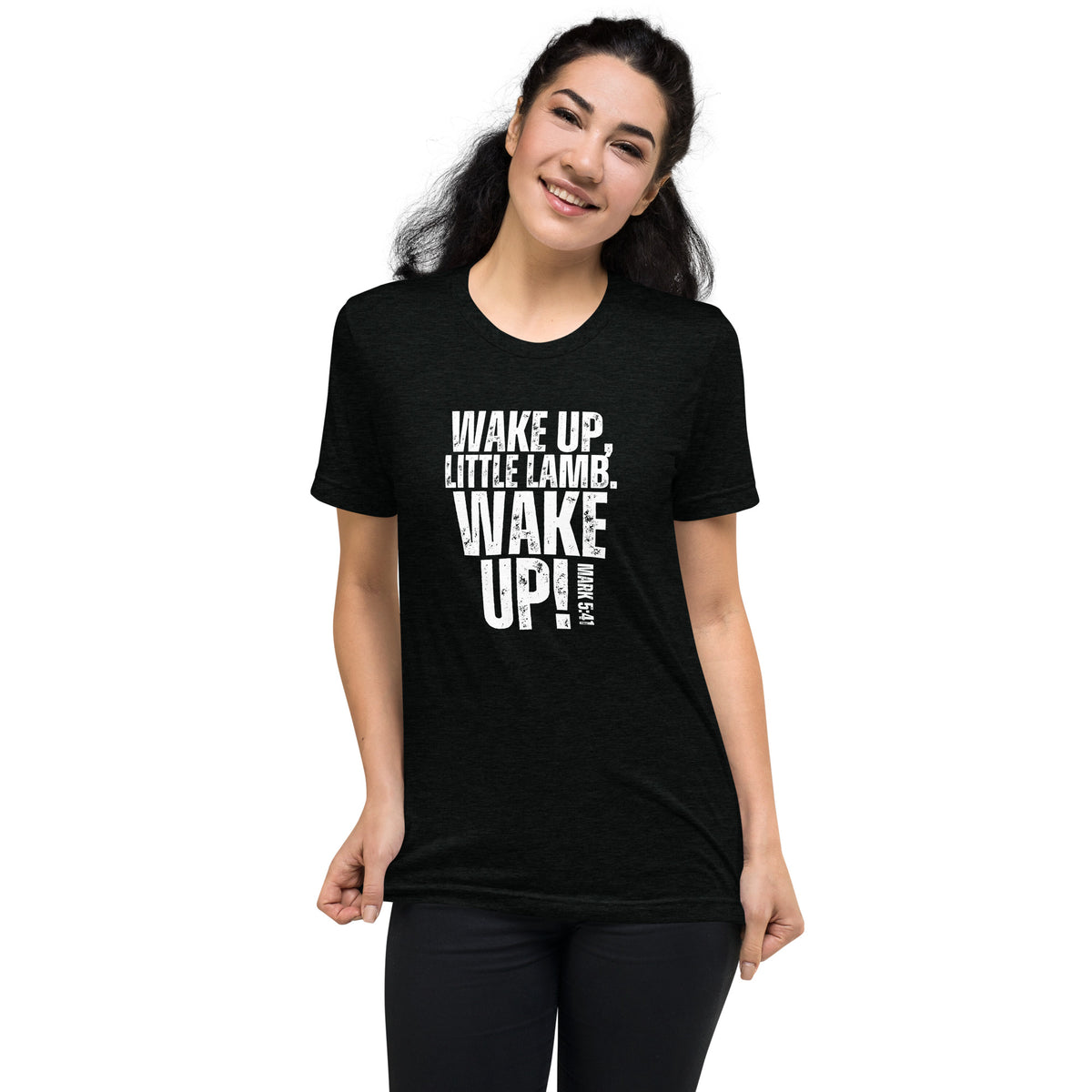 Model wearing a black Wake Up Little Lamb Christian T-shirt with white Wake Up lettering