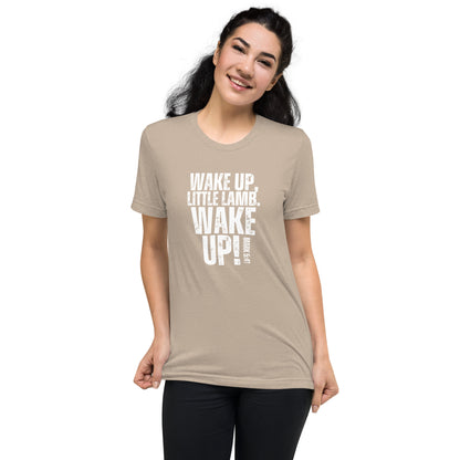 Woman wearing a tan Wake Up Little Lamb Christian T-shirt with white Wake Up graphic
