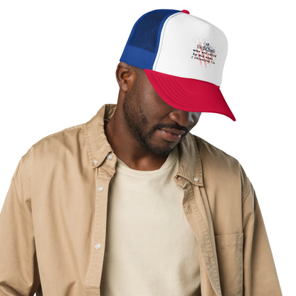 Man wearing the red, white, and blue We The People Christian trucker hat